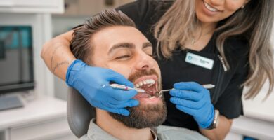 a person brushing a person's teeth