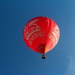 red hot air balloon in the sky