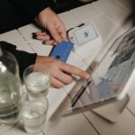 A person pays for their order on a tablet.
